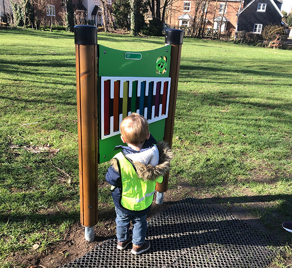 boy playing with sensory play equipment, Banks Park Playground