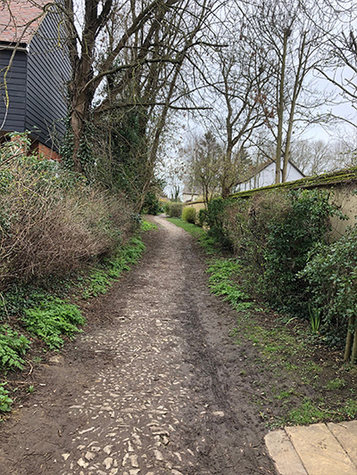 cobblestones and greenery along Stockwell Footpath