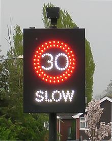 vehicle activated sign displaying 30 miles per hour