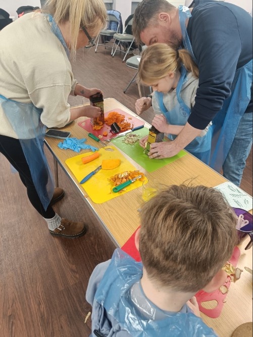 Family Enjoying the Love Food, Hate Waste Cooking Workshop